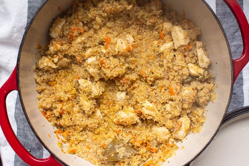 chicken and quinoa cooked in red pot