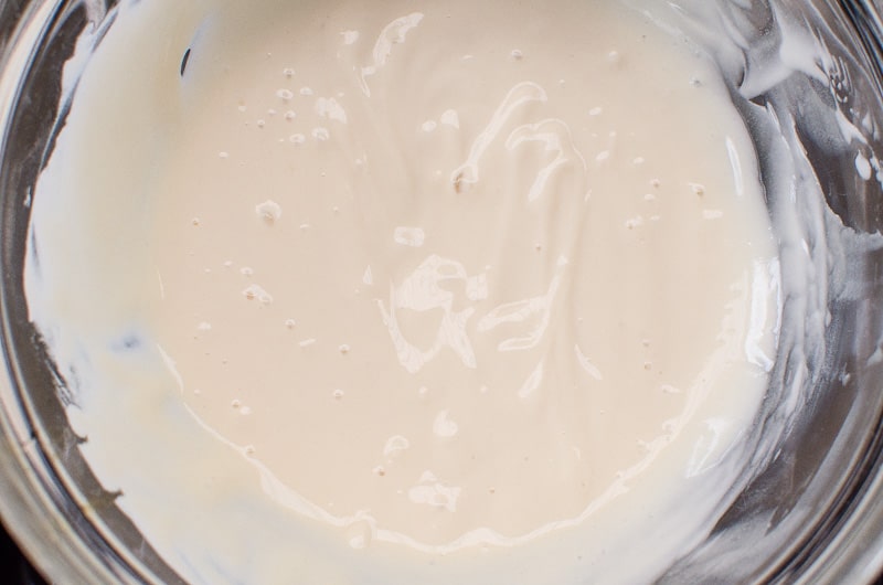 Healthy Cinnamon Rolls yogurt frosting in a bowl