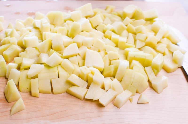 Diced potatoes on a cutting board.