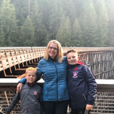 Olena with her kids on the bridge.