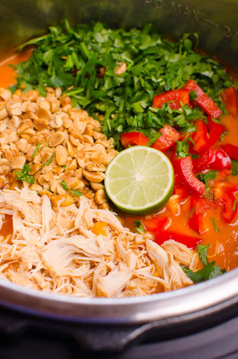 Instant Pot Thai Chicken Soup ingredients include shredded chicken, bell pepper, cilantro, lime