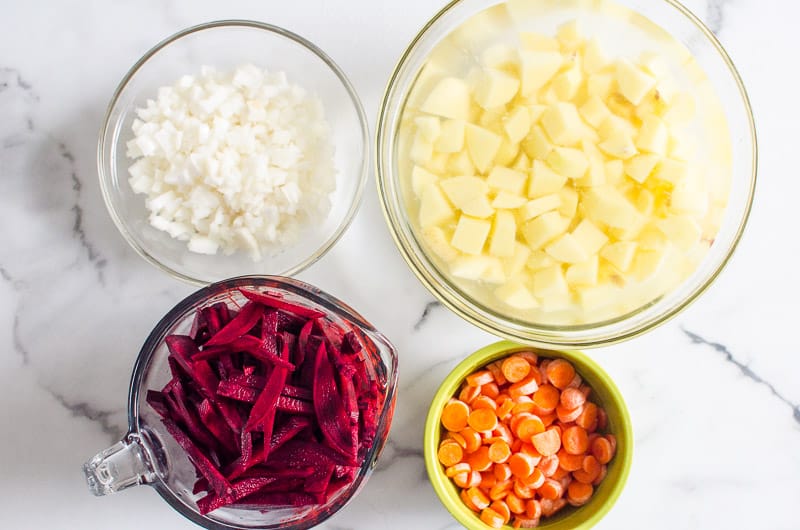 sliced and diced beets, onions, carrots and potatoes