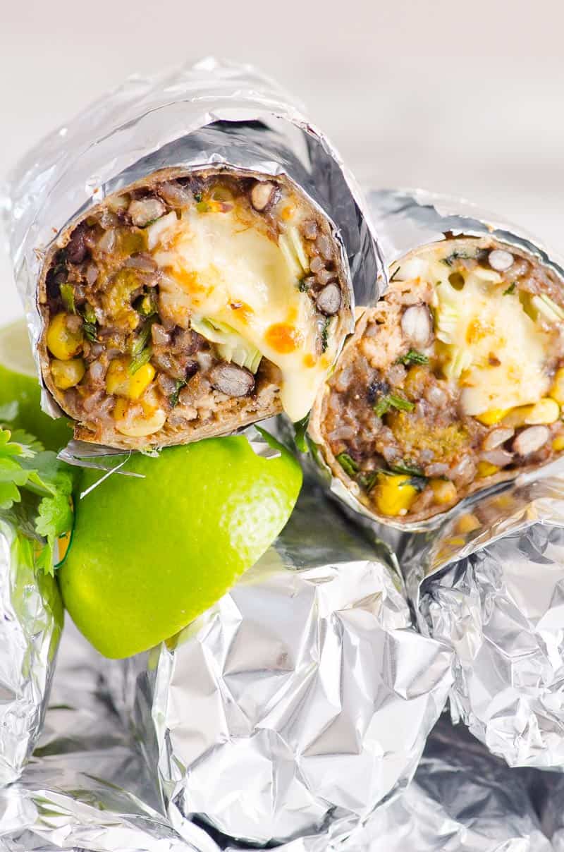 Chicken burritos wrapped in foil.