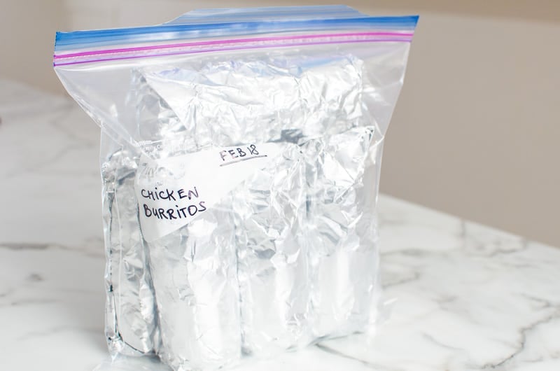 chicken burritos wrapped in tin foil and packaged in freezer bag