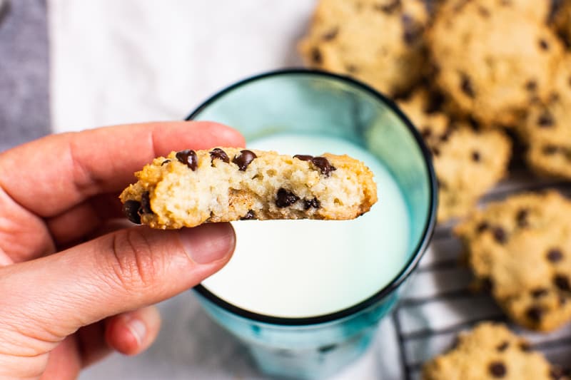 Almond Flour Chocolate Chip Cookie dunked in a glass of milk