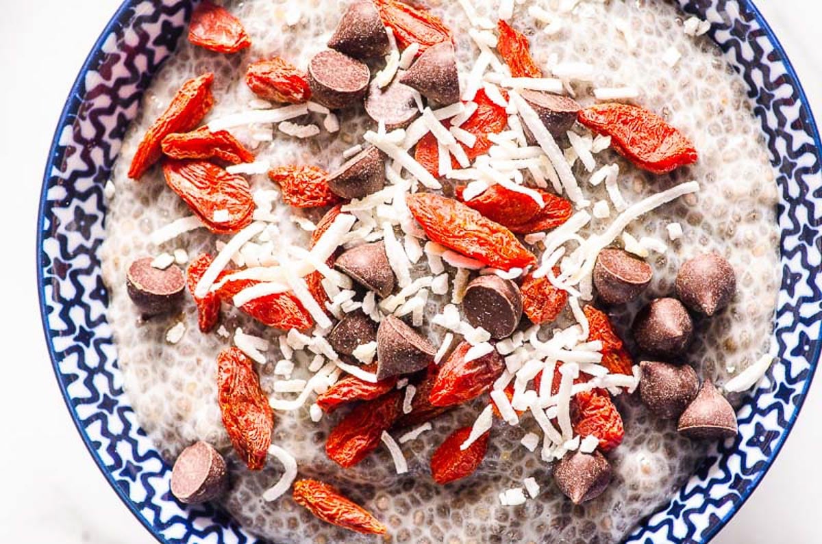 Chia Pudding topped with goji berries, coconut flakes and chocolate chips