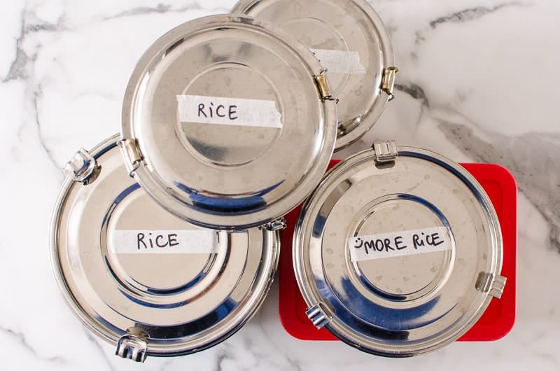 Brown rice in metal containers to freeze.
