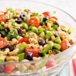 Healthy pasta salad with vegetables in a serving bowl.