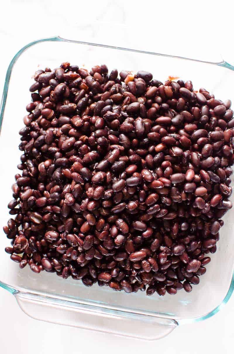 Instant Pot black beans in a glass baking dish.