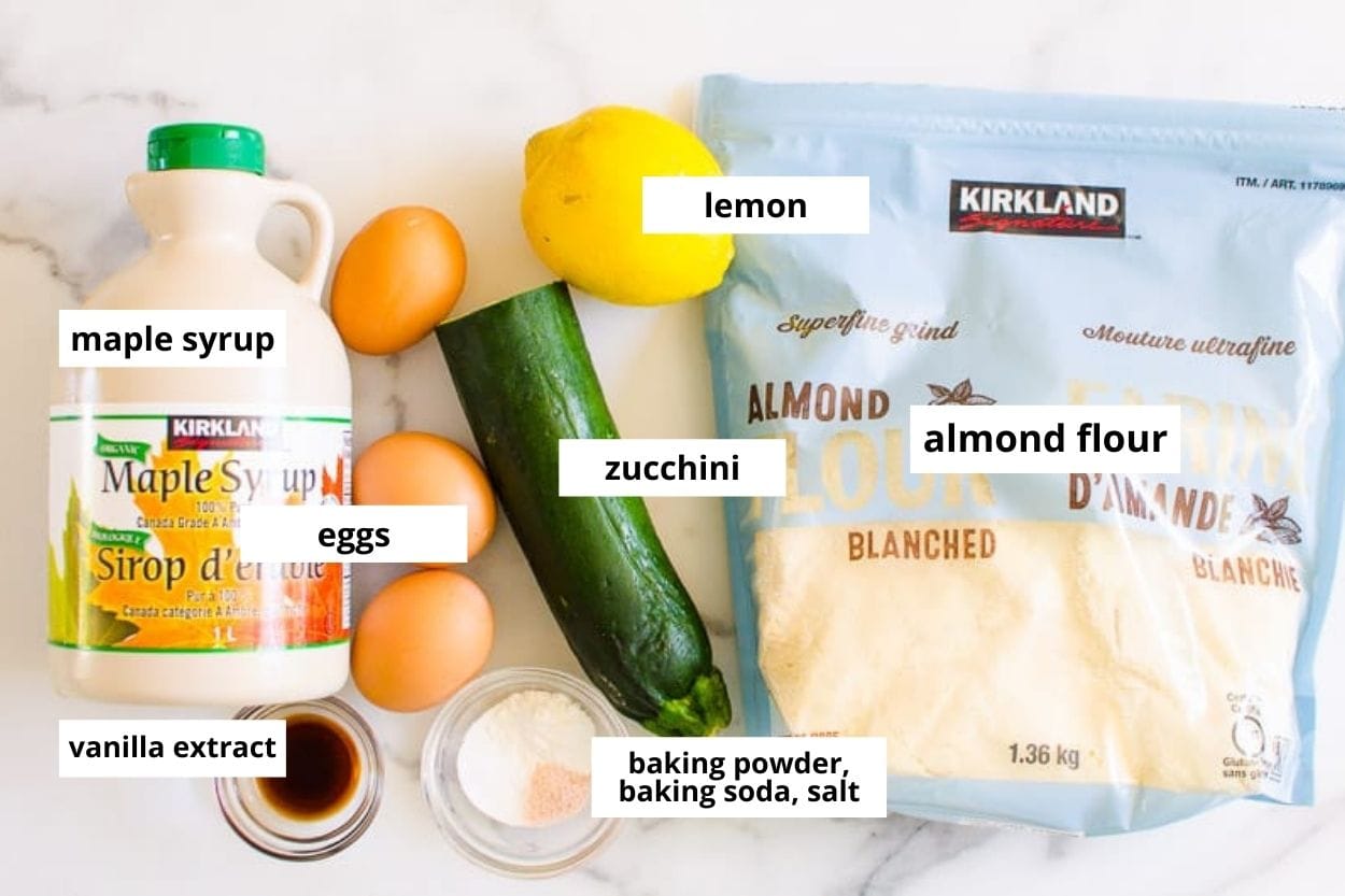Almond flour, lemon, zucchini, eggs, maple syrup, vanilla extract, baking powder, baking soda, salt.