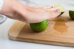 rolling by hand lime on a cutting board