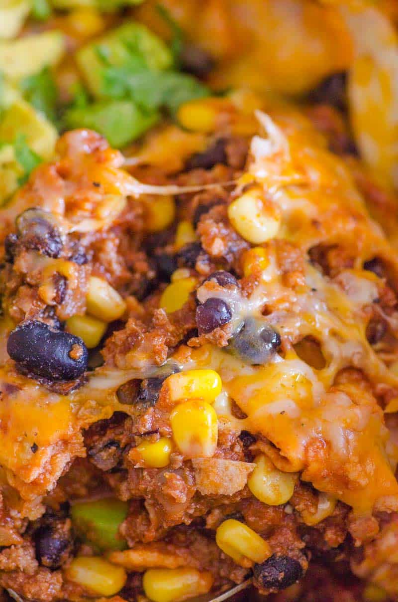 closeup cheesy skillet one pot enchiladas with black beans and corn