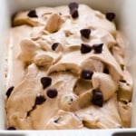 Healthy chocolate ice cream topped with chocolate chips in a ceramic dish.