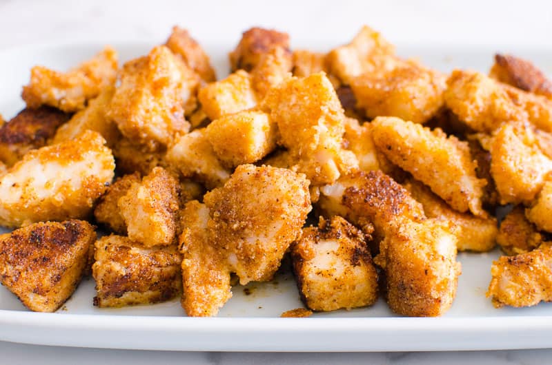 Fried fish for fish tacos on a platter.