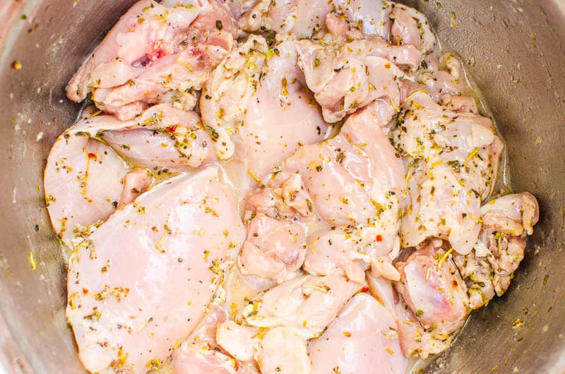 Chicken marinating in bowl. 