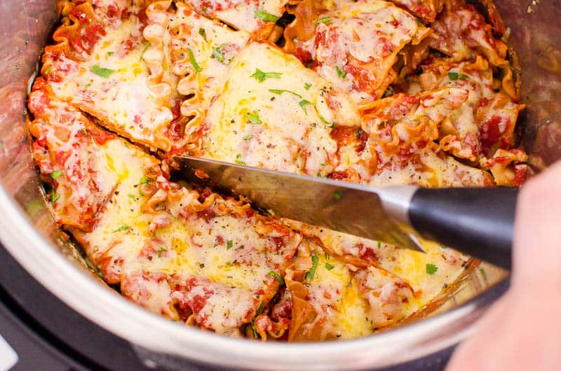 Instant Pot lasagna being sliced for serving.