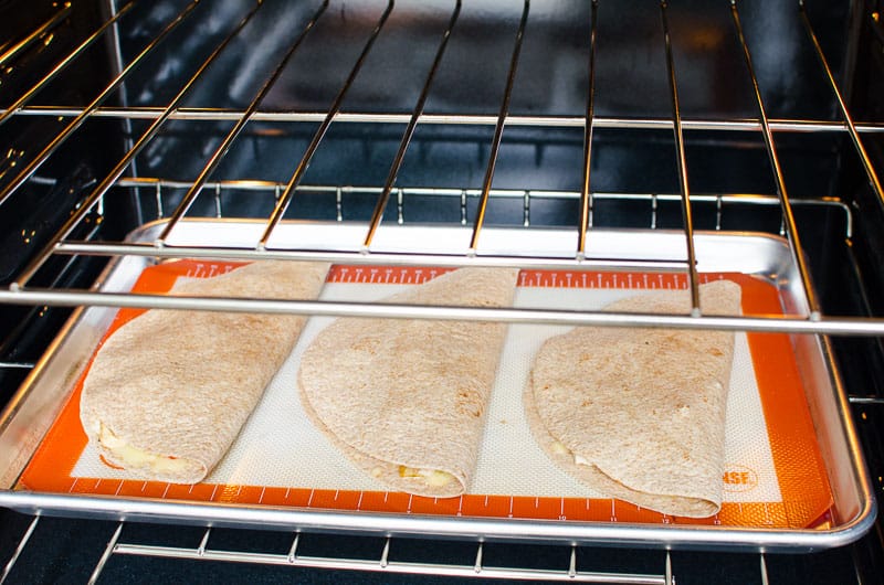 Quesadillas in oven on baking sheet. 