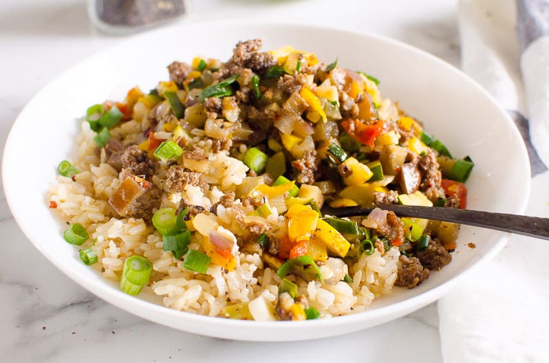korean ground beef rice bowl in bowl with fork