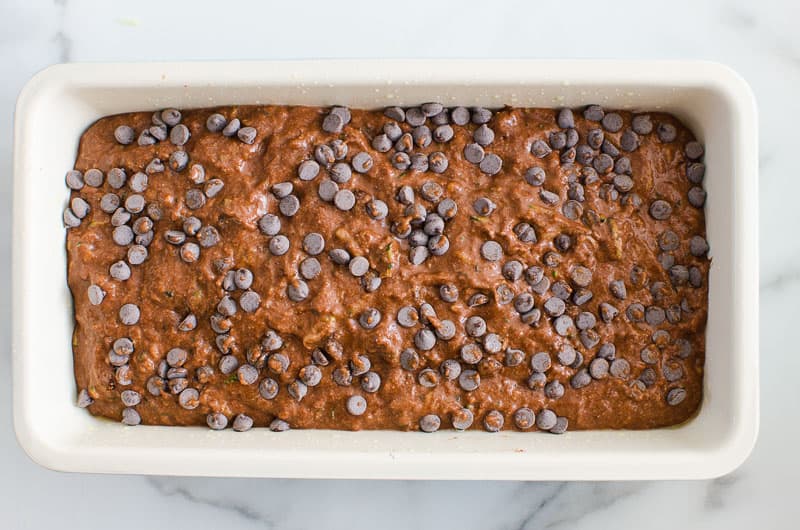 Healthy Chocolate Zucchini Bread in a loaf pan going into the oven