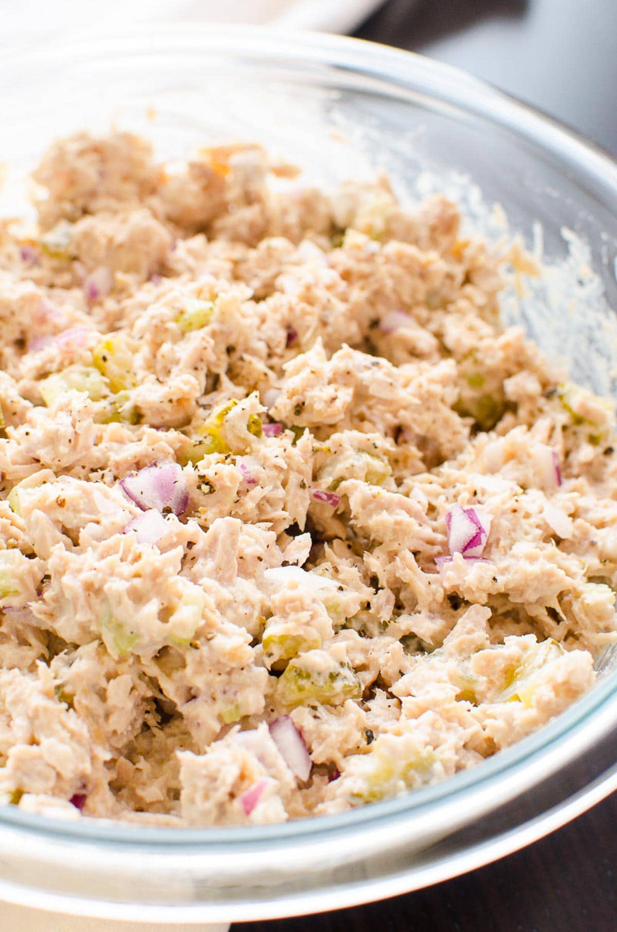 Healthy tuna salad in glass bowl.