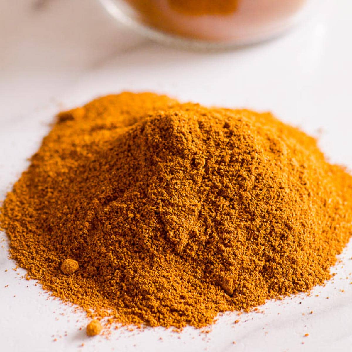 Pumpkin pie spice substitute in a pile on counter.