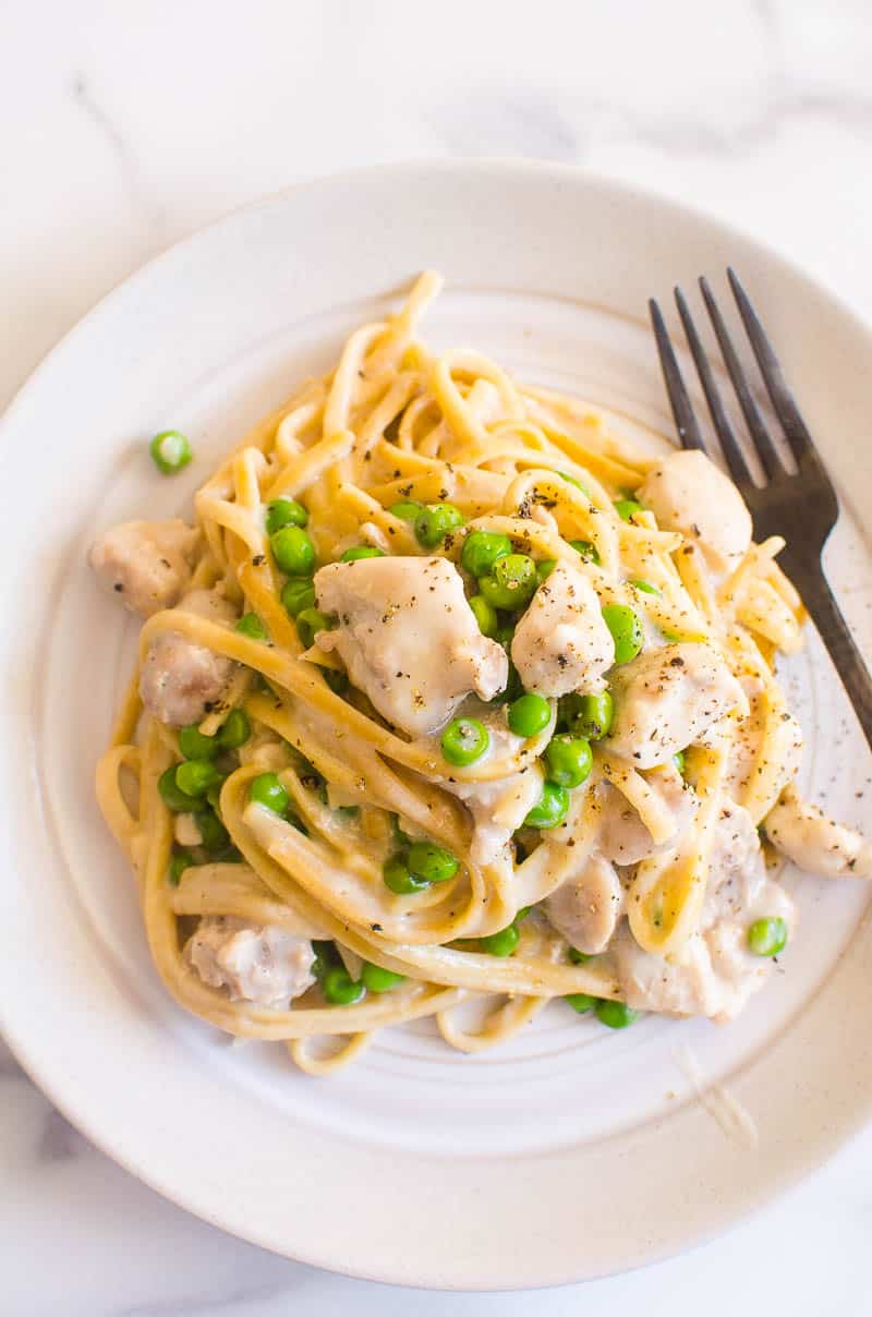 Healthy Chicken Alfredo served on a plate with a fork