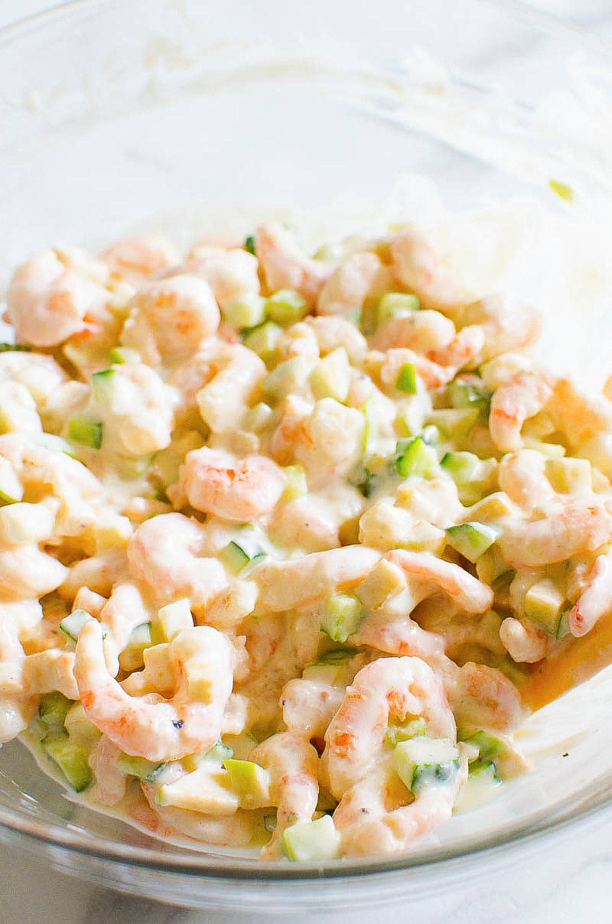 Healthy shrimp salad with Greek yogurt dressing in a salad bowl.