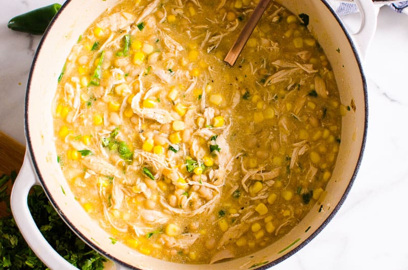 Healthy White Chicken Chili in a pot with a spoon