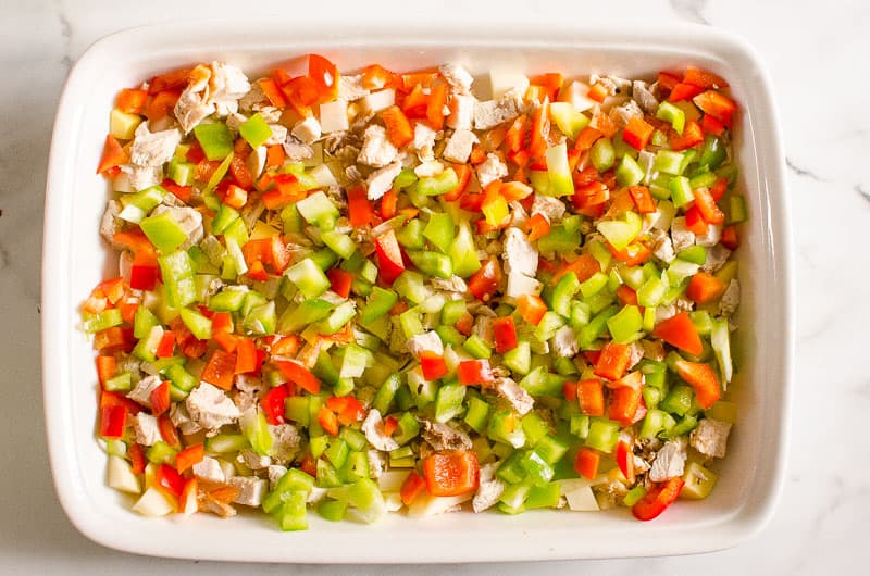 chopped peppers and meat in casserole dish