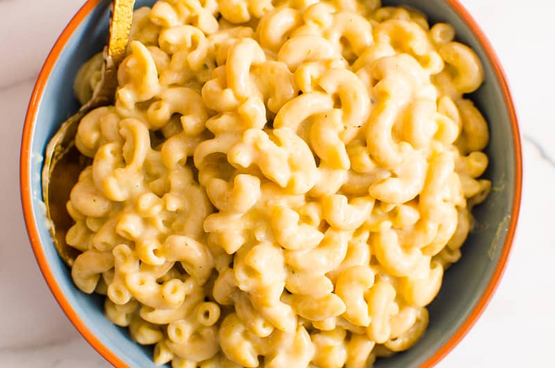 A close up of a bowl of mac and cheese.