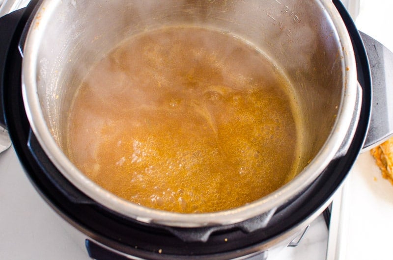 Gravy simmering in Instant Pot.