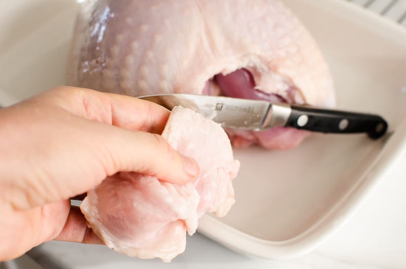 cutting turkey breast skin