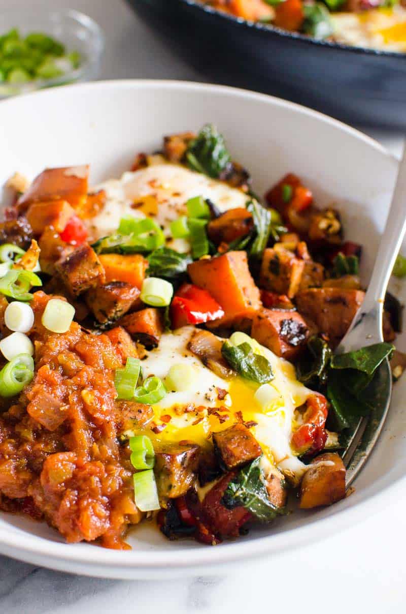sweet potato hash recipe in a bowl with a fork