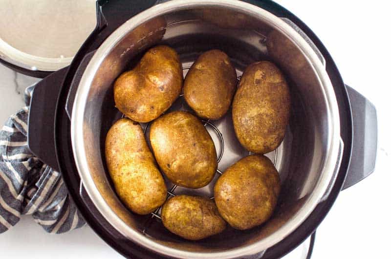Potatoes in Instant Pot with trivet and water.