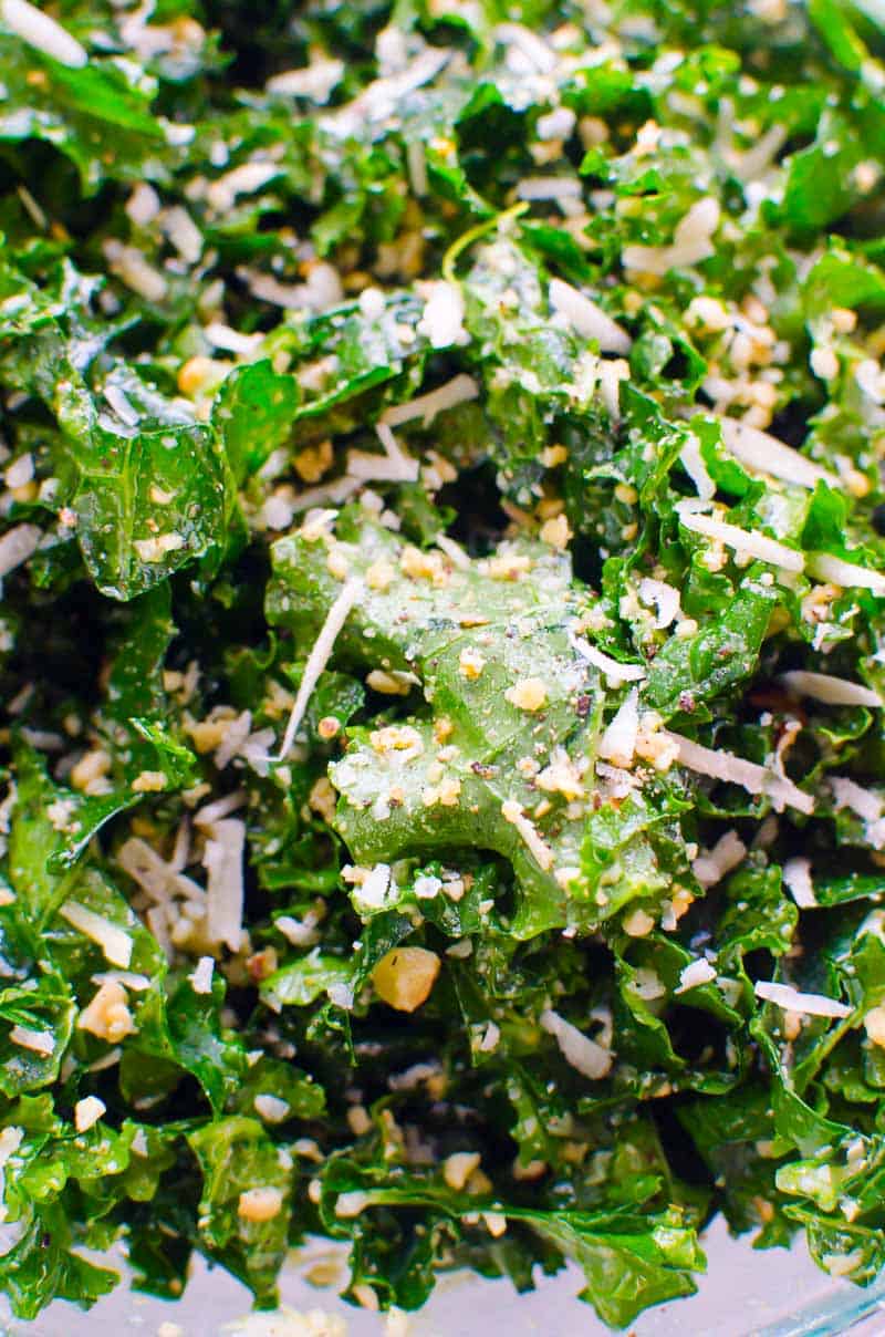kale salad with parmesan cheese, toasted nuts and lemon