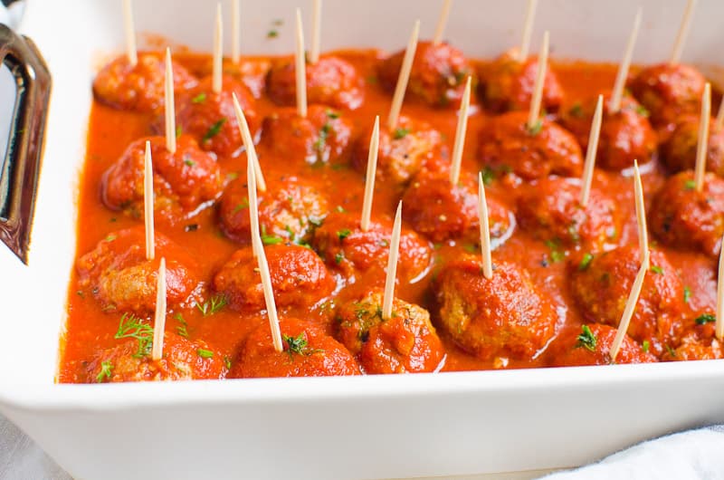 instant pot meatballs with toothpicks in a baking dish