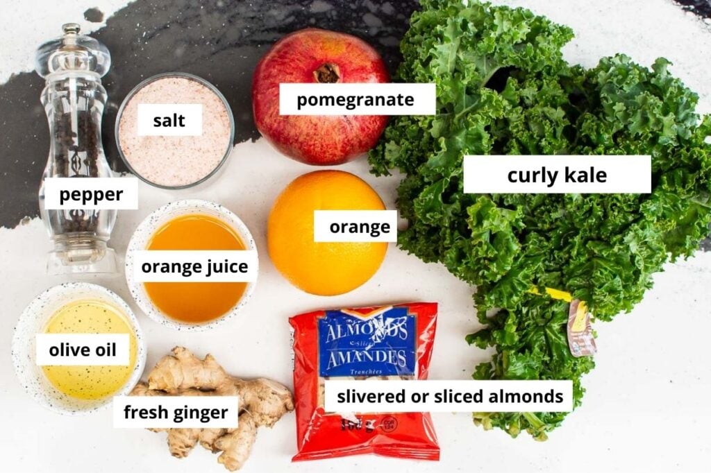 massaged winter kale salad ingredients with orange pomegranate and ginger dressing