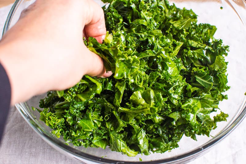 massaging kale for salad