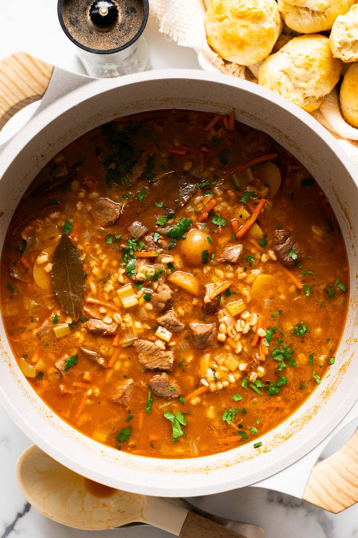 Beef and barley soup in a pot.