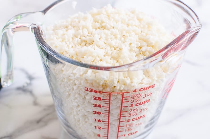 cauliflower rice in a glass measuring cup