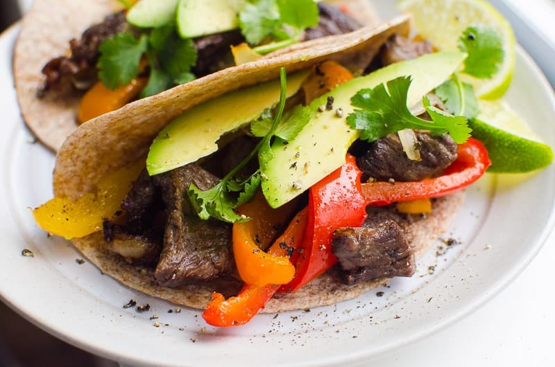 Oven Steak Fajitas in whole wheat tortilla with avocado, cilantro and lime