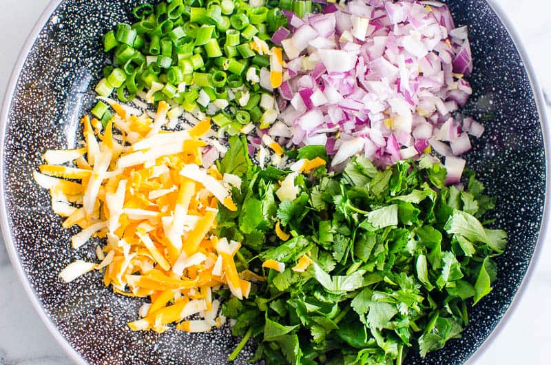 instant pot chili toppings include cilantro, red onion, green onion, cheese
