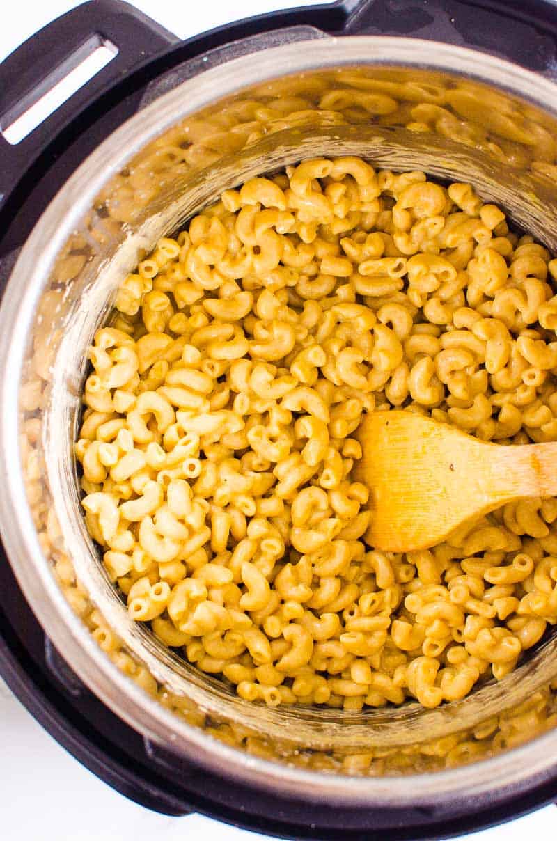 Instant Pot mac and cheese with wooden spoon.