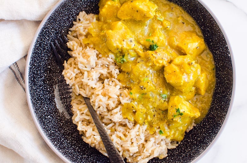 plate of chicken curry with brown rice