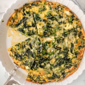 Crustless spinach quiche in a baking dish.