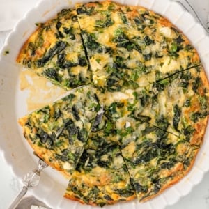 Crustless spinach quiche in a baking dish.