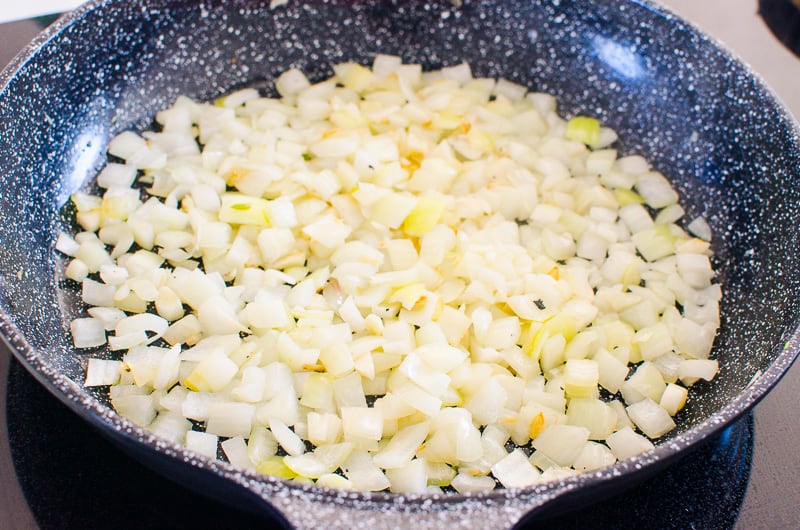 Diced onion in a skillet. 