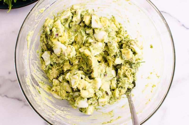 Avocado Egg Salad in a glass bowl with a fork