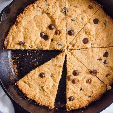 Healthy skillet cookie sliced in cast iron skillet.