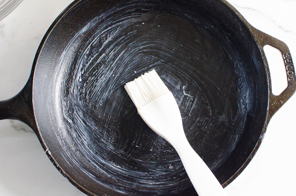 Cast iron skillet brushed with oil.